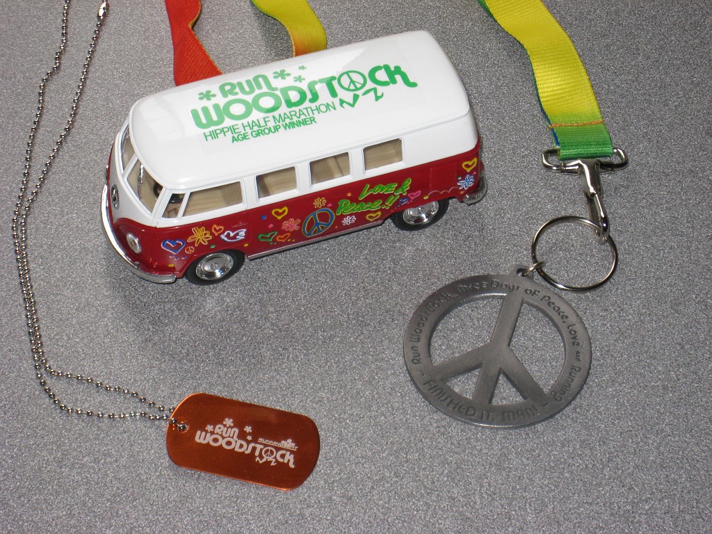 Woodstock HM 2010 005.JPG - The age group award (the micro bus) for finishing second in the 60-64 group. Also the finishers (peace) medal (Man!) and a dog tag they gave out as part of the "wounded warrior" sponsorship)